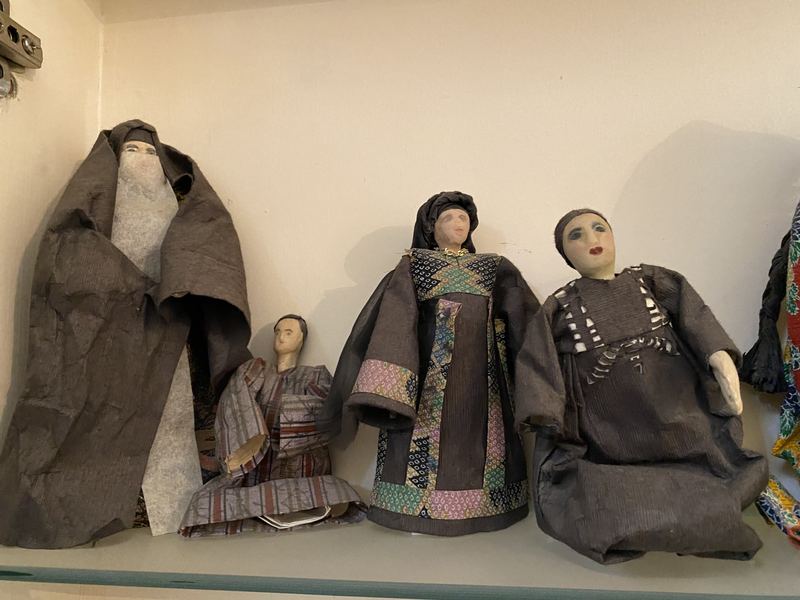Bedouin Figures in Dark Robes